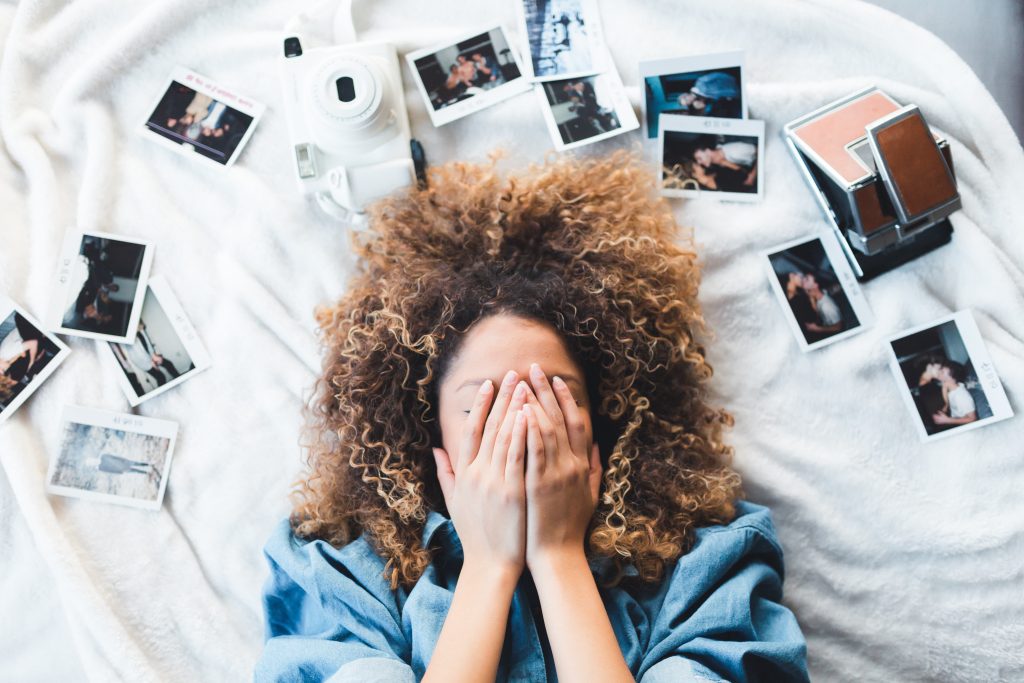 The Memory Curator: Image of person overwhelmed by the photo mess